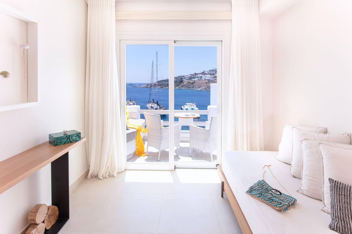 sunshine junior suite, sea view | living area | 18-inch flat-screen tv with satellite channels, tv