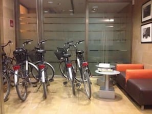 Relax and unwind in our lobby, featuring a cozy seating area with a couch and table, and a bike-friendly space.