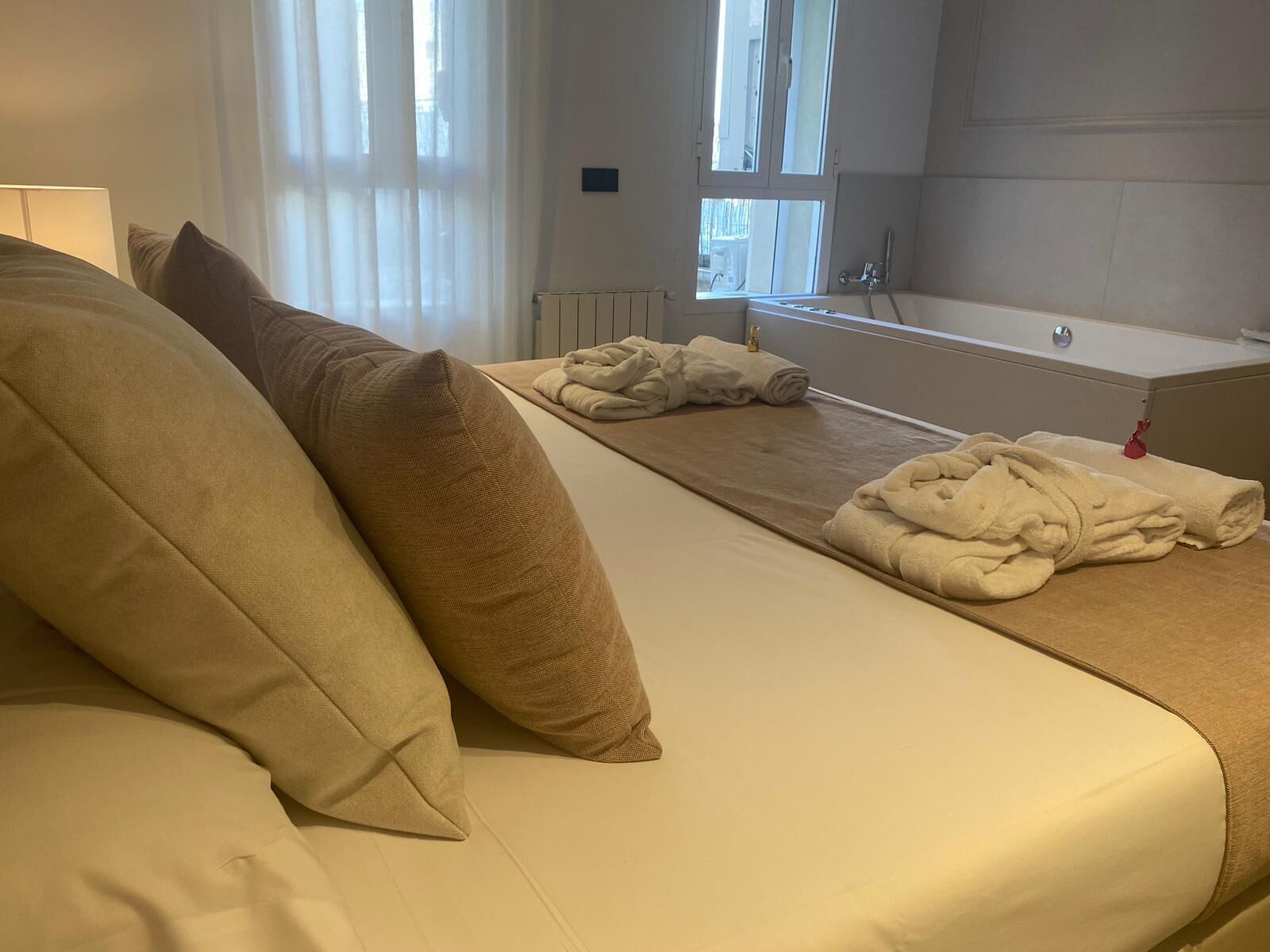 deluxe room with jacuzzi | in-room safe, desk, soundproofing, iron/ironing board