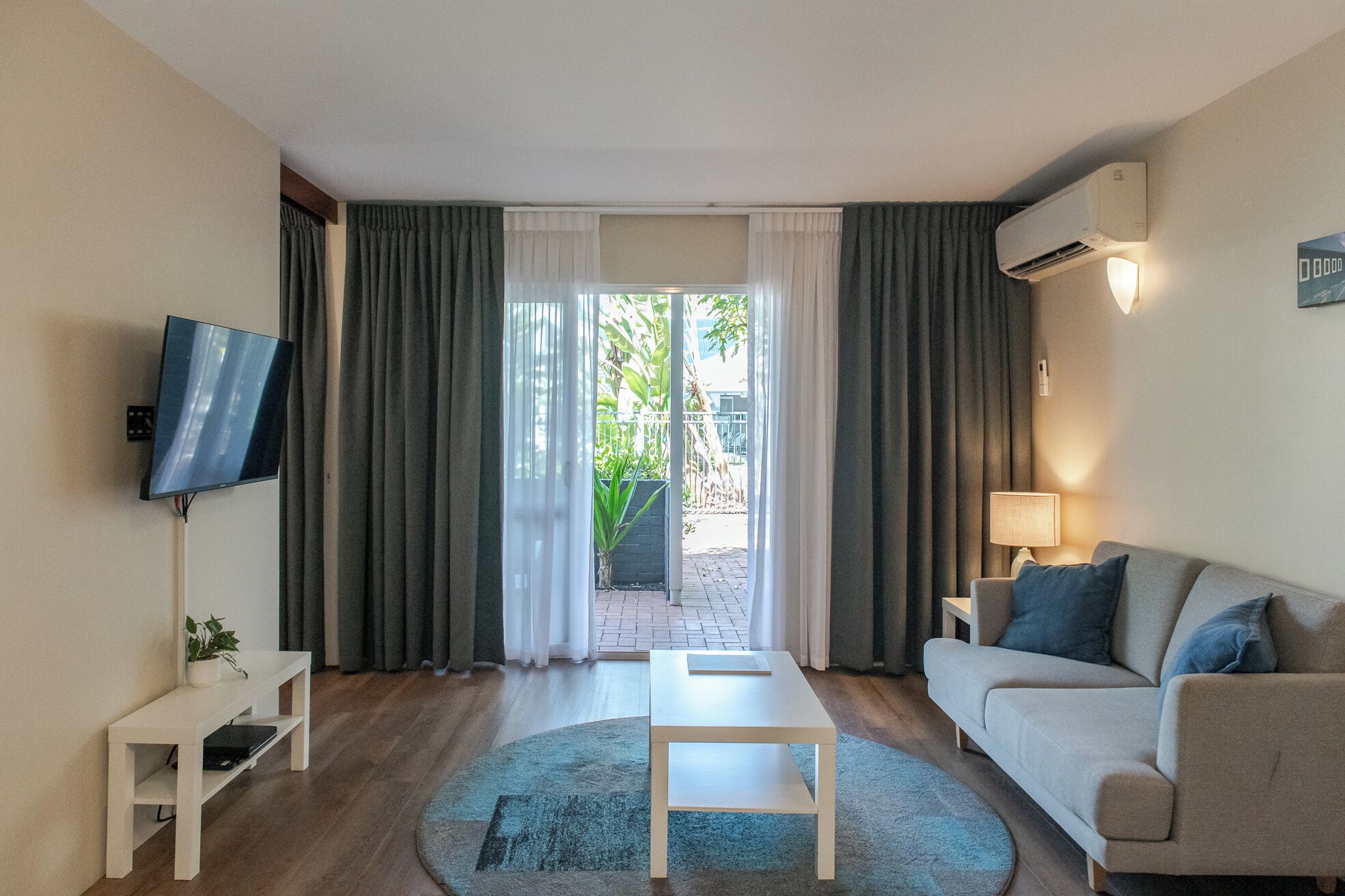 1 Bedroom Apartment | Living area | 50-inch TV with digital channels, DVD player