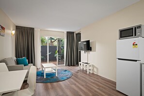 1 Bedroom Apartment | Living area | 50-inch TV with digital channels, DVD player - Broadwater Resort WA Tourism Award 2025 Gold Winner (Broadwater)