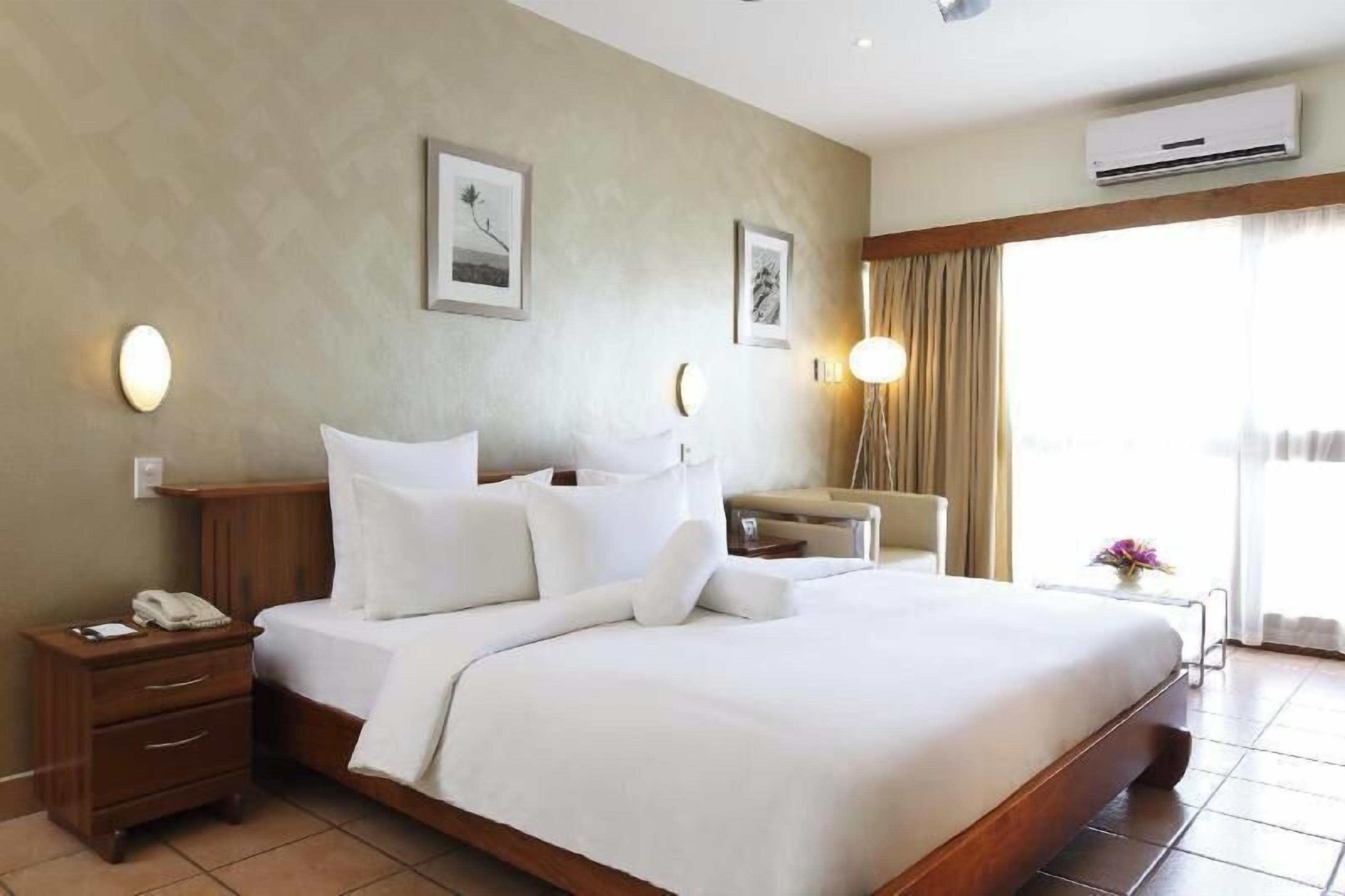 Premium bedding, down duvets, in-room safe, desk