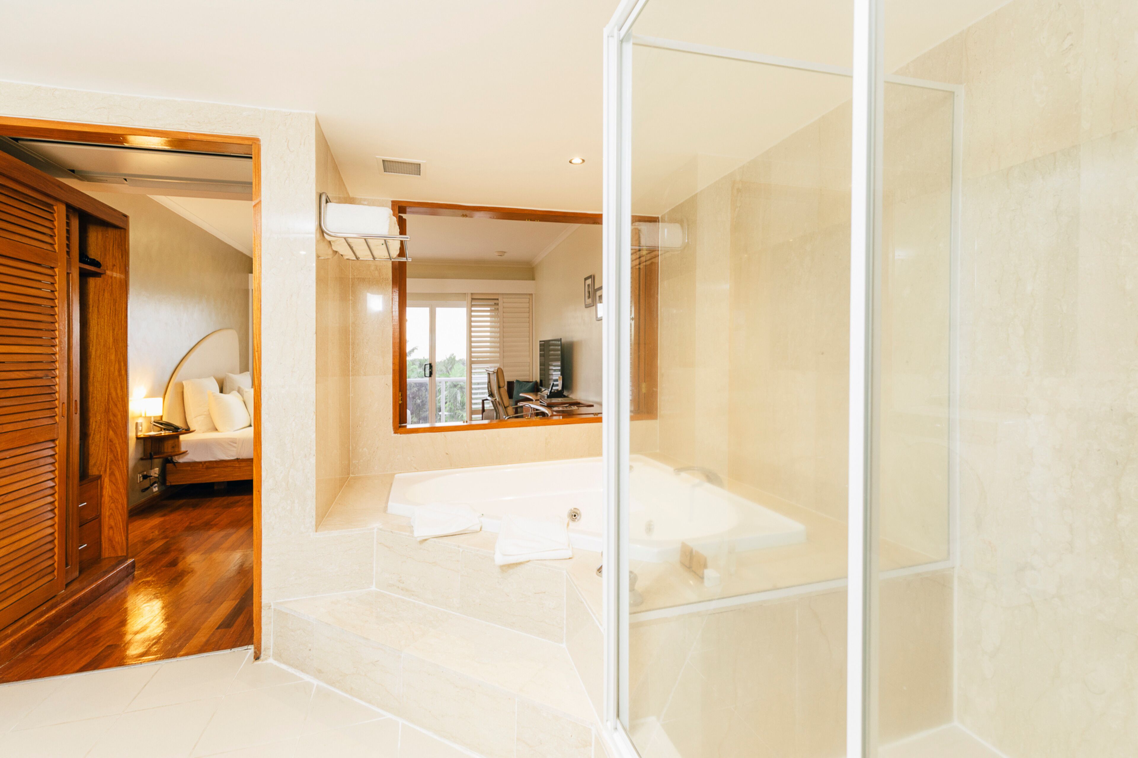 fountain suite | bathroom | shower, designer toiletries, hair dryer, slippers