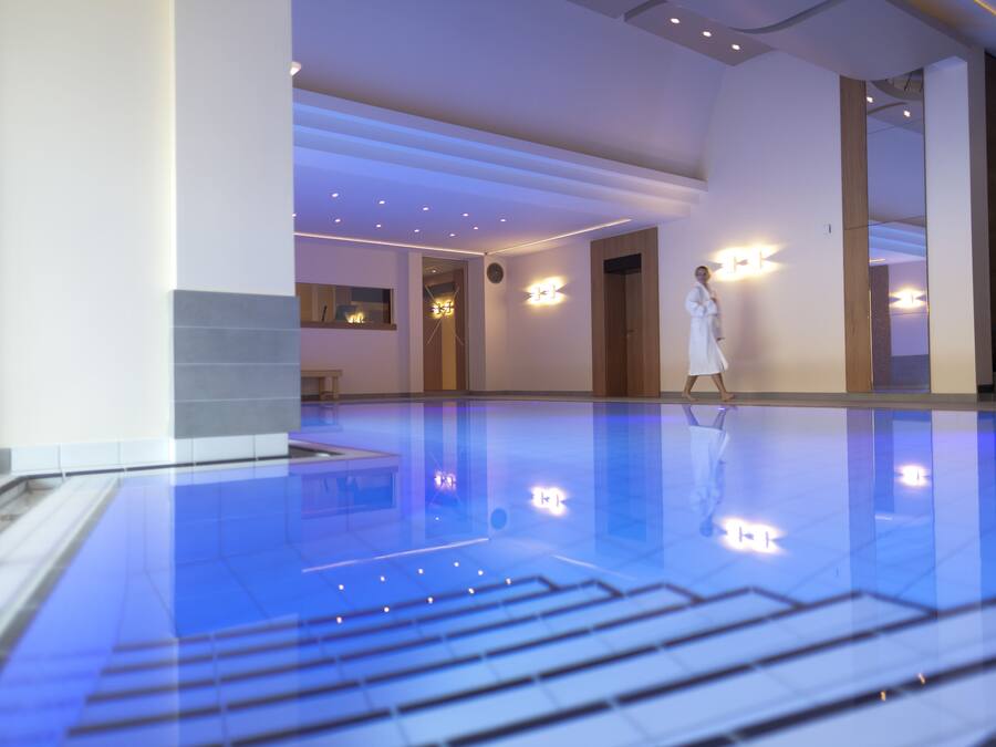 Indoor pool, open 6:00 AM to 10:00 PM, pool loungers