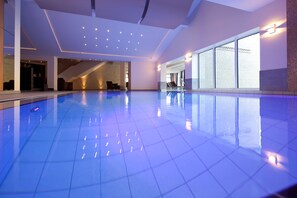 Indoor pool, open 6:00 AM to 10:00 PM, pool loungers