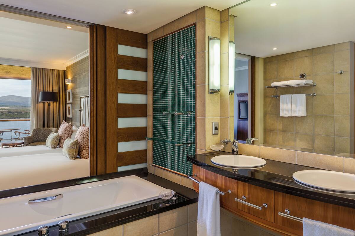 Bathroom | Separate tub and shower, designer toiletries, hair dryer, bathrobes