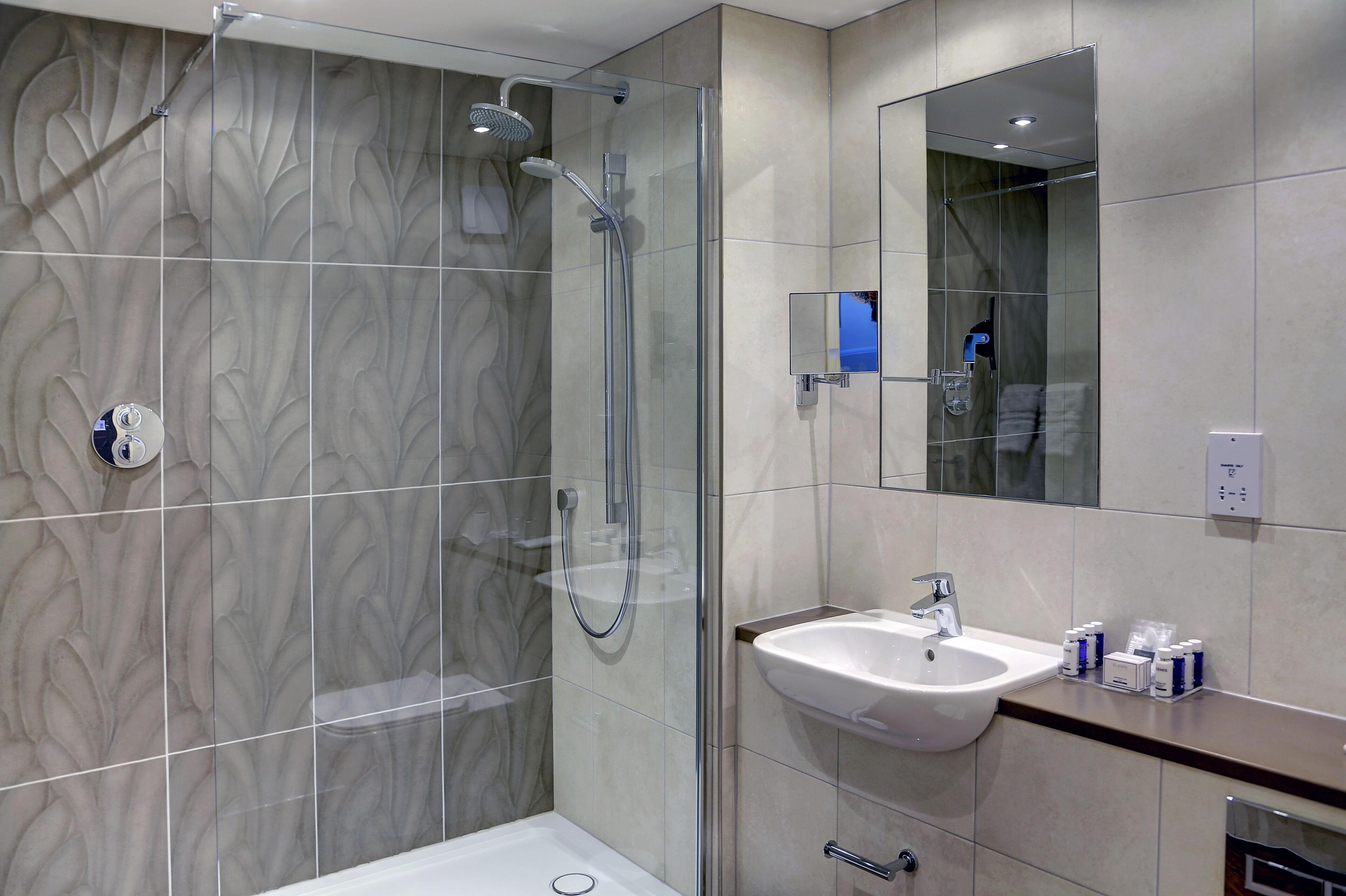 combined shower/bathtub, free toiletries, hair dryer, bathrobes