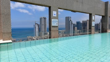 Outdoor pool, open 6:30 AM to 10:30 PM, pool umbrellas, sun loungers