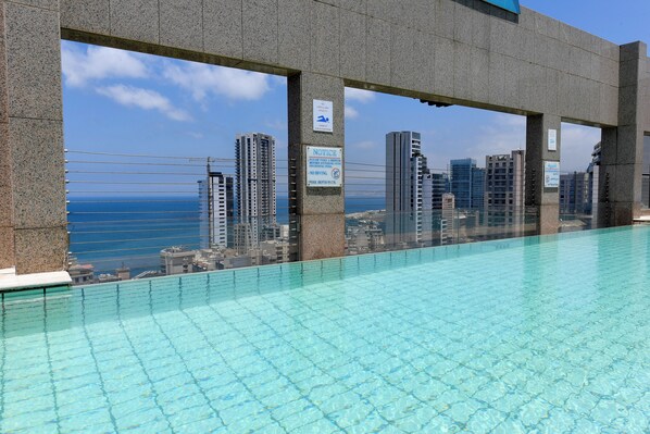 Outdoor pool, open 6:30 AM to 10:30 PM, pool umbrellas, pool loungers