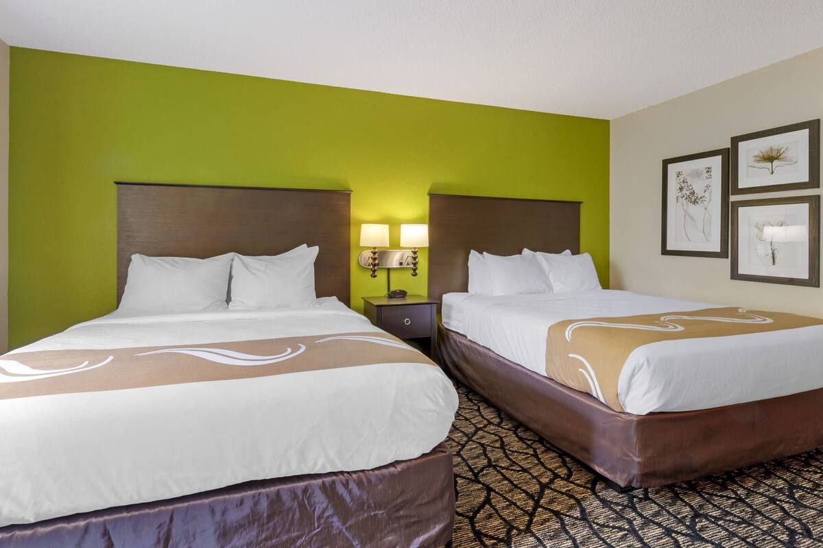 Desk, laptop workspace, iron/ironing board, cribs/infant beds