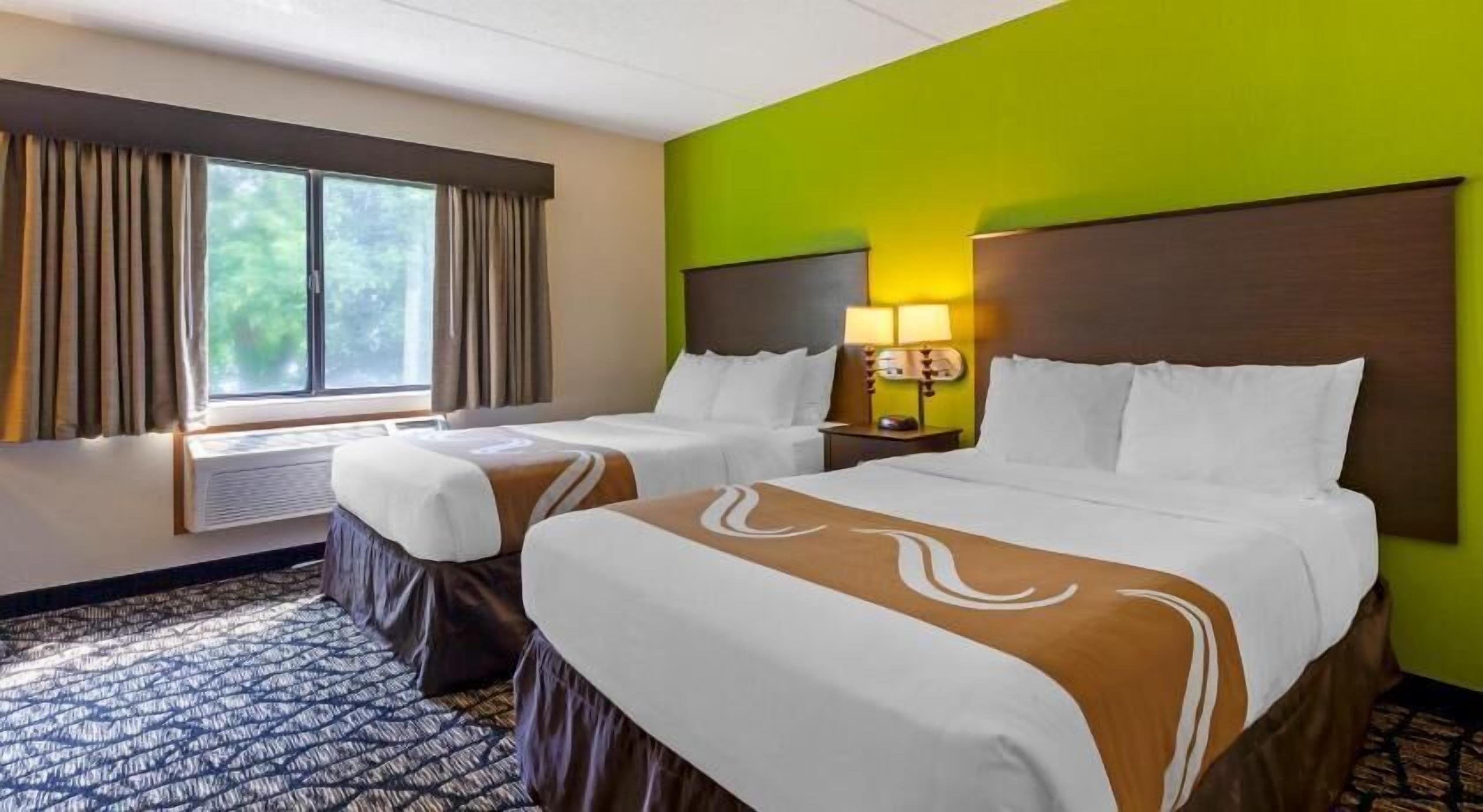 Desk, laptop workspace, iron/ironing board, cribs/infant beds