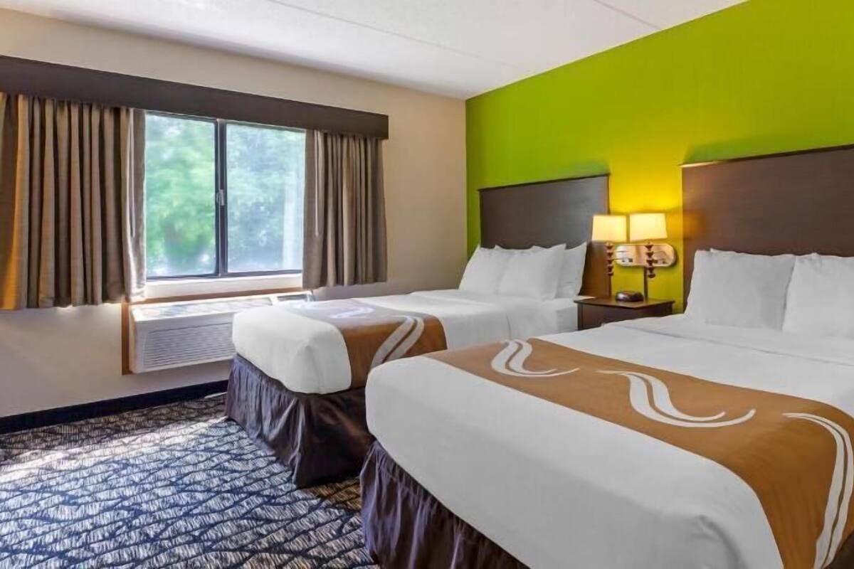 Desk, laptop workspace, iron/ironing board, cribs/infant beds