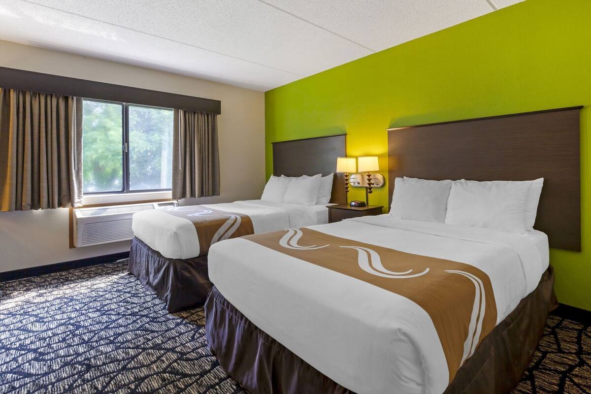 Desk, laptop workspace, iron/ironing board, cribs/infant beds