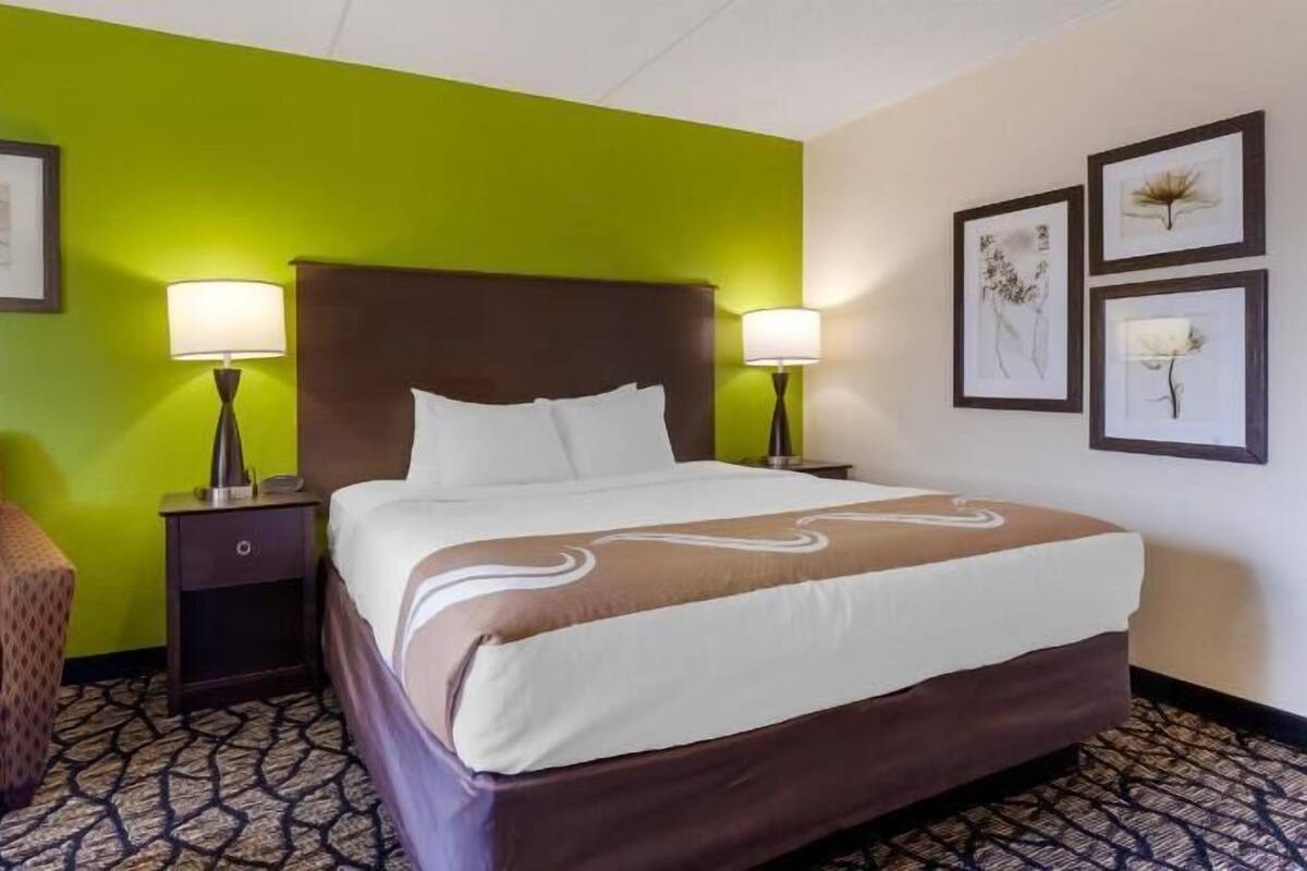 Desk, laptop workspace, iron/ironing board, cribs/infant beds