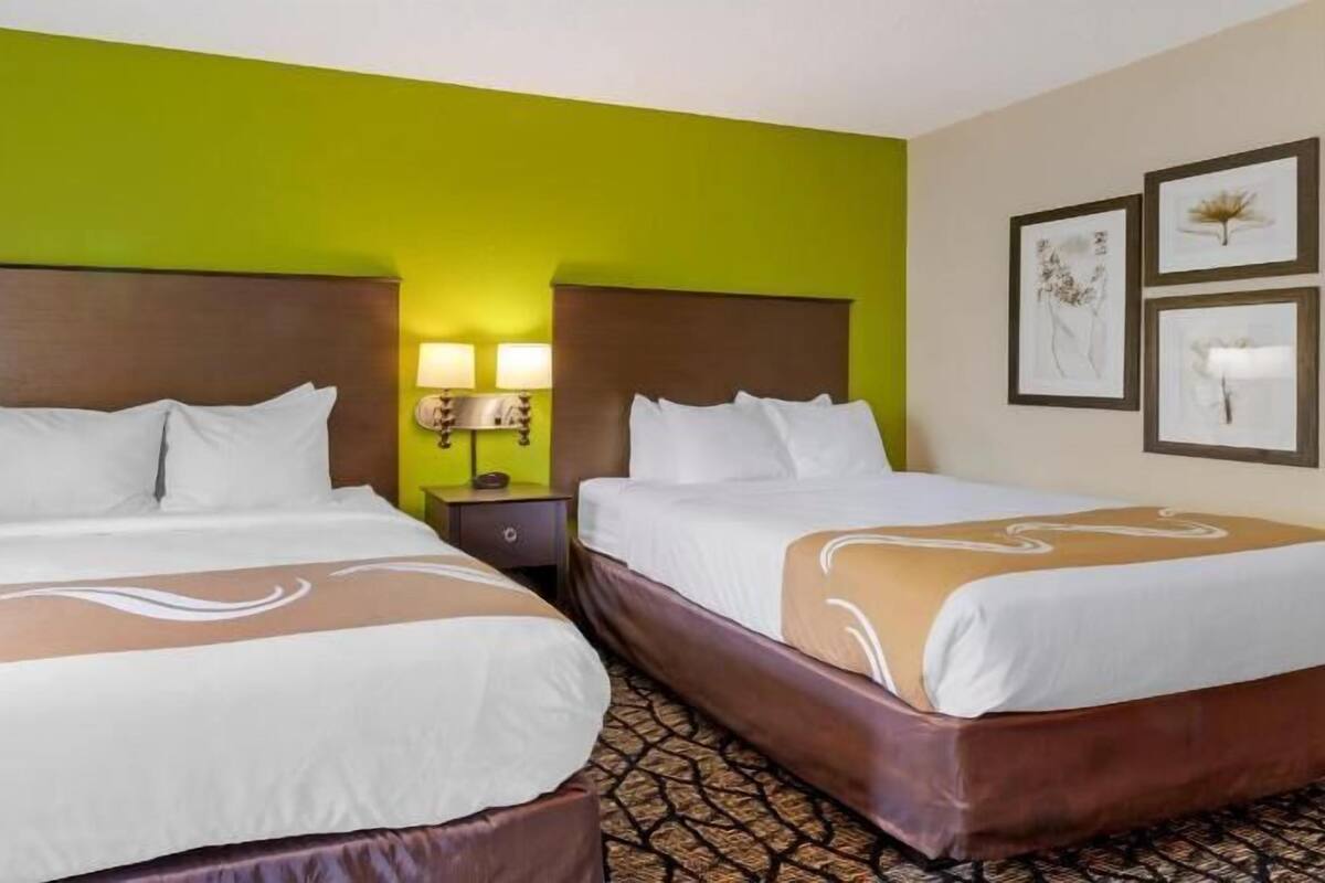 Desk, laptop workspace, iron/ironing board, cribs/infant beds