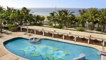 Indoor pool, outdoor pool, pool umbrellas