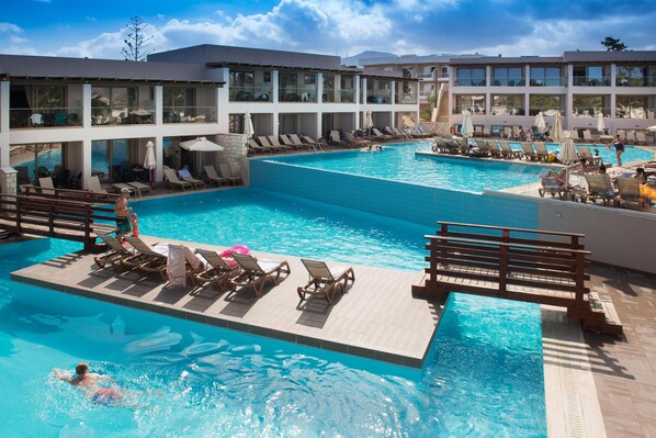 Seasonal outdoor pool, open 10:00 AM to 6:30 PM, pool umbrellas