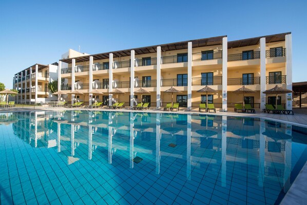 Seasonal outdoor pool, open 10:00 AM to 6:30 PM, pool umbrellas