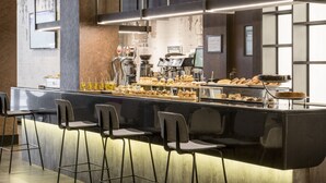 A modern bar area with stools, a coffee machine, and various pastries. - Hotel ILUNION Bilbao (Bilbao)