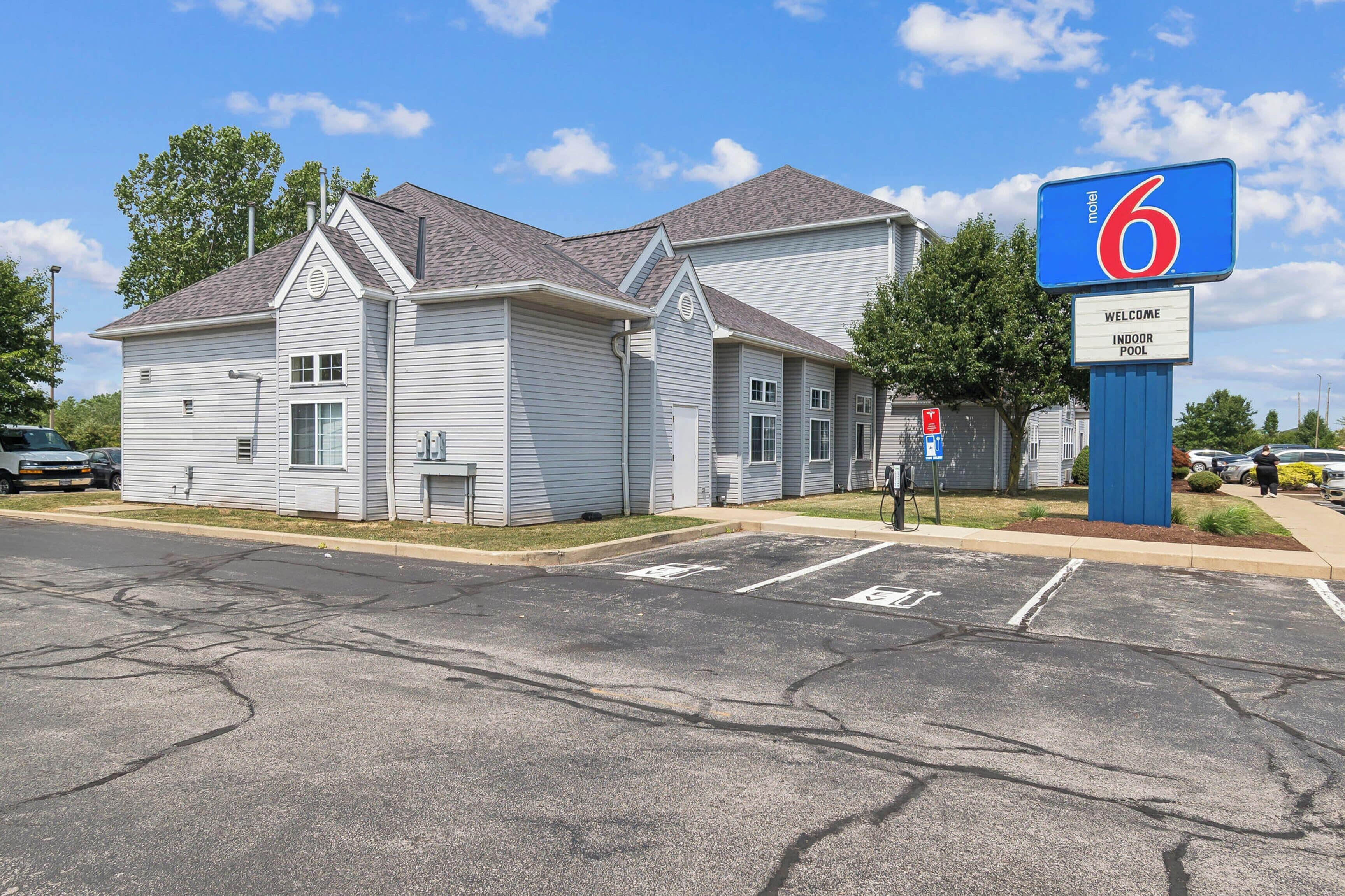 A motel with a large sign indicating it is number 6.