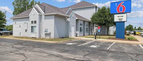 A motel with a large sign indicating it is number 6.