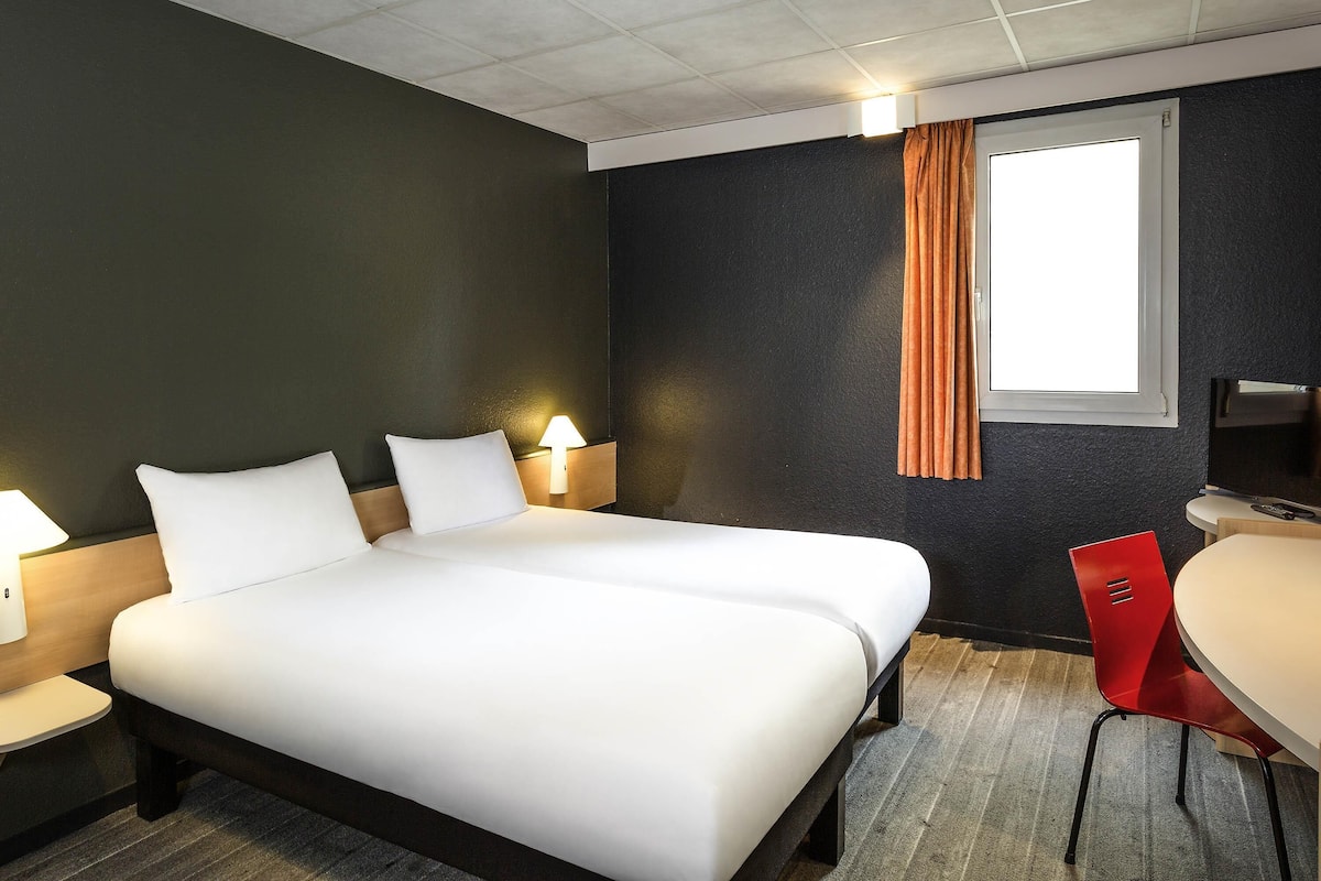 Premium bedding, pillow-top beds, desk, blackout curtains