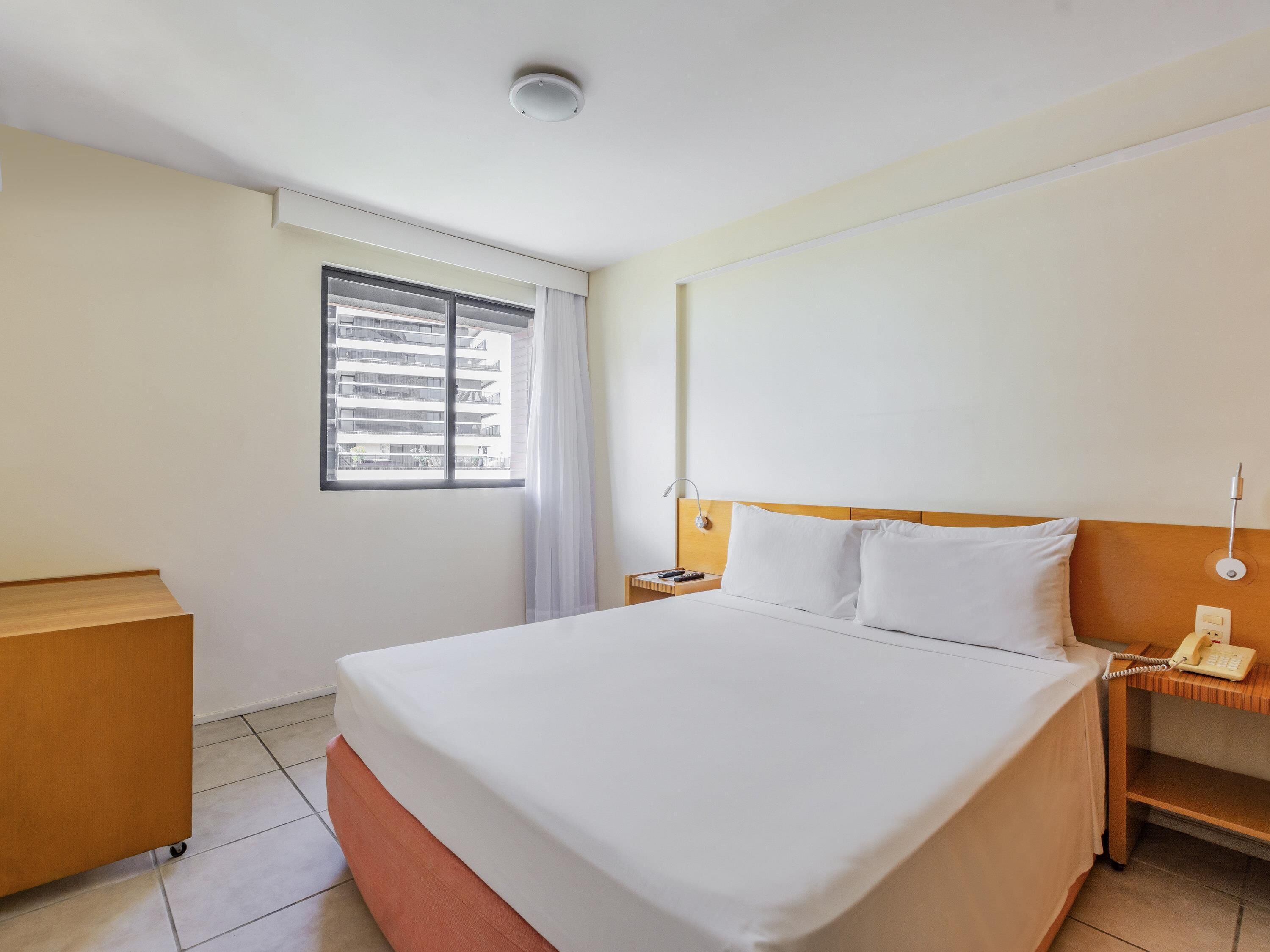 Family Room, 2 Bedrooms | Minibar, in-room safe, individually furnished, desk