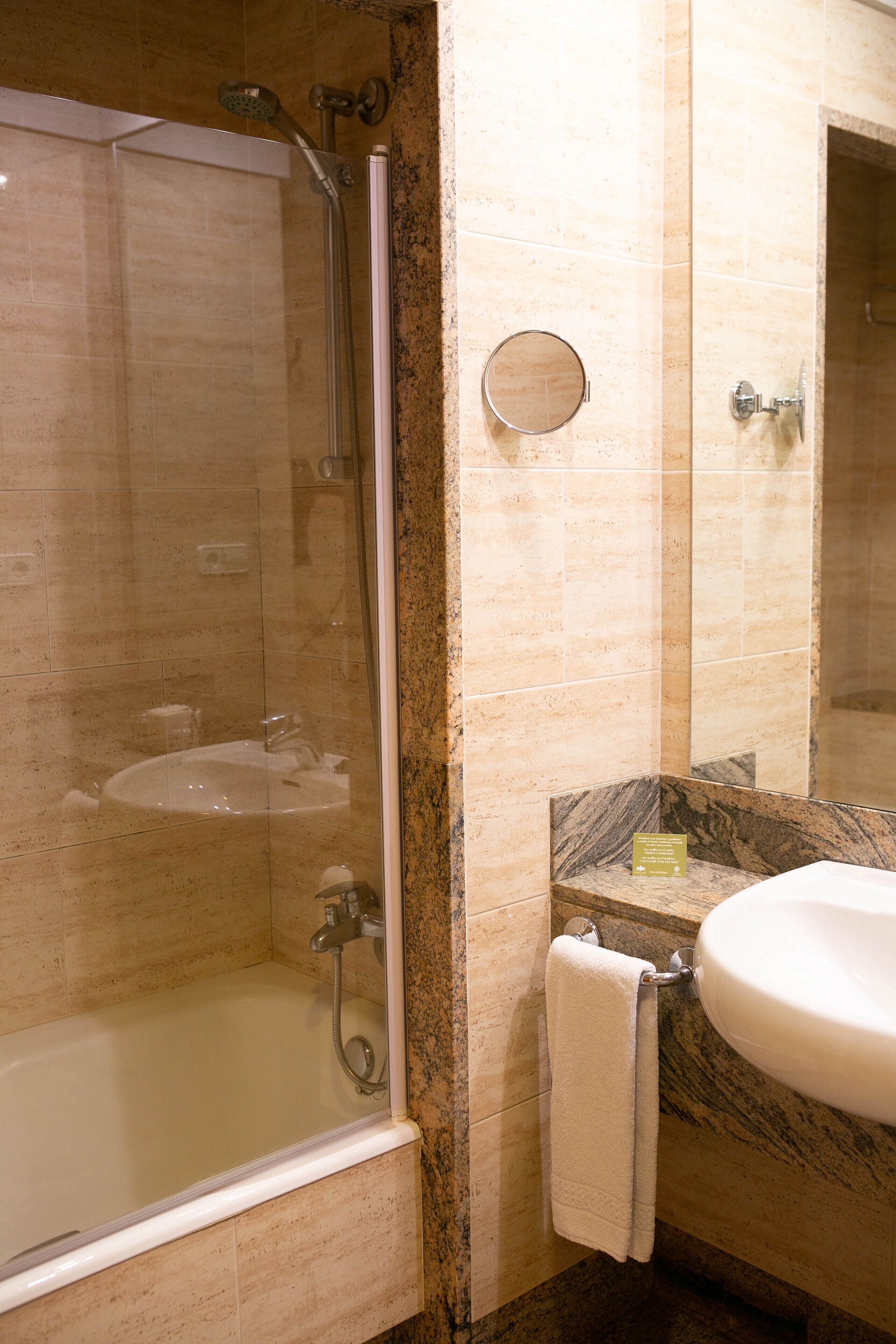 bathtub, free toiletries, hair dryer, towels