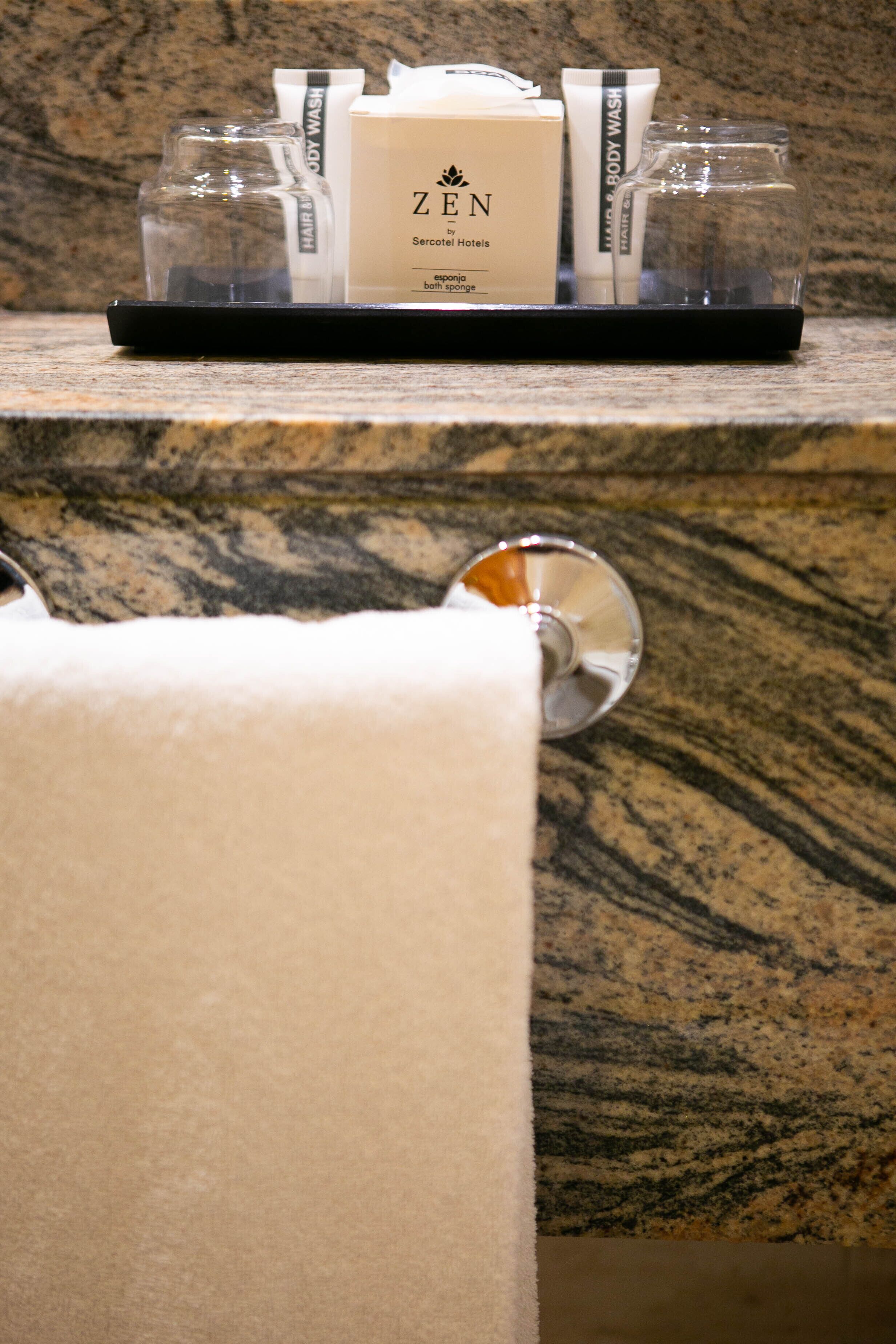 bathtub, free toiletries, hair dryer, towels