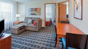 A hotel room with a sofa, a TV, a desk, and a bed. - TownePlace Suites by Marriott -Minneapolis West/StLouis Park (St. Louis Park)