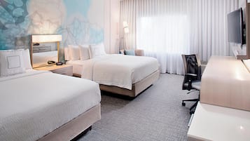 Hypo-allergenic bedding, pillowtop beds, desk, laptop workspace