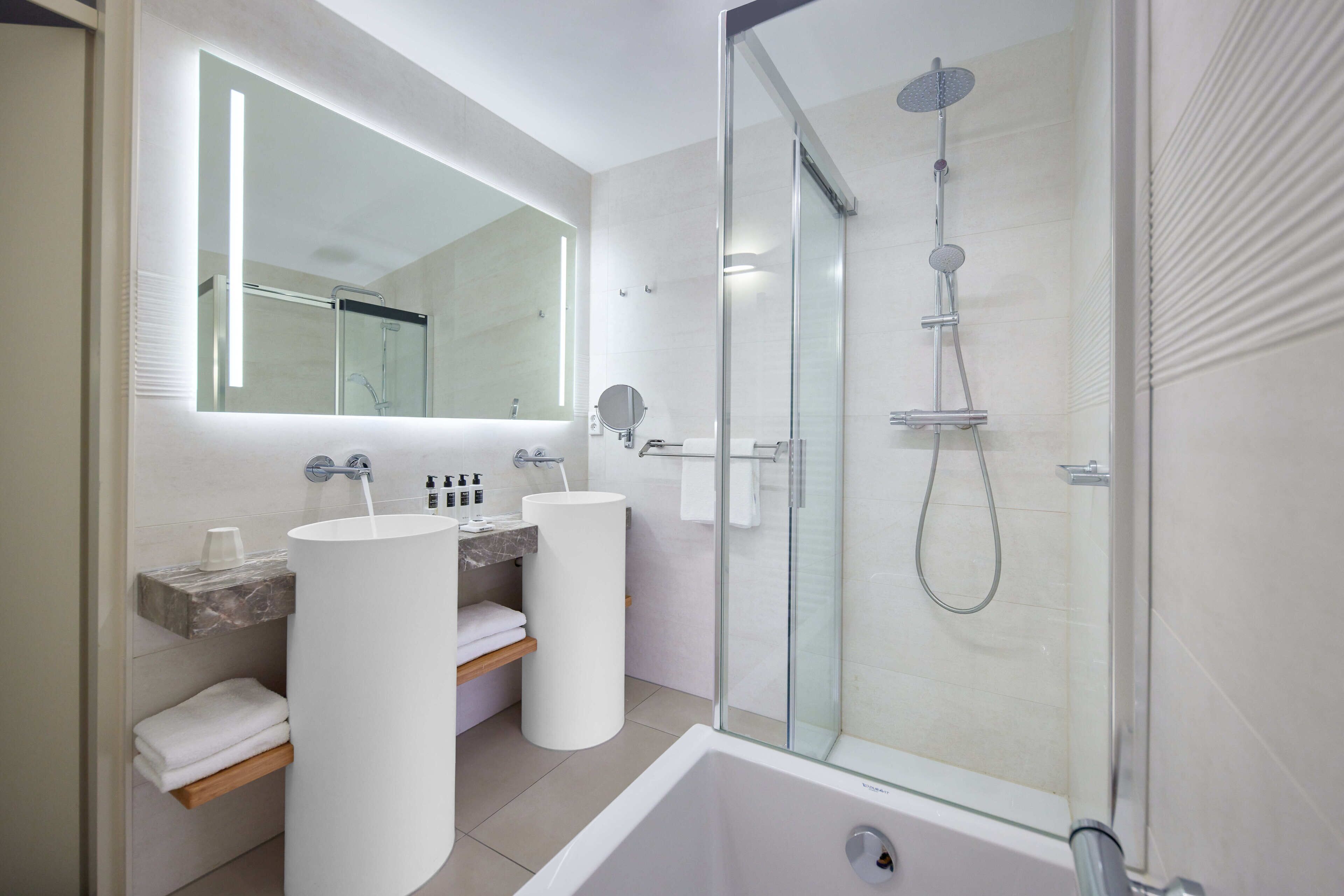 separate bathtub and shower, eco-friendly toiletries, hair dryer, towels