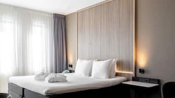 Hypoallergeen beddengoed, een minibar, een kluis op de kamer, een bureau