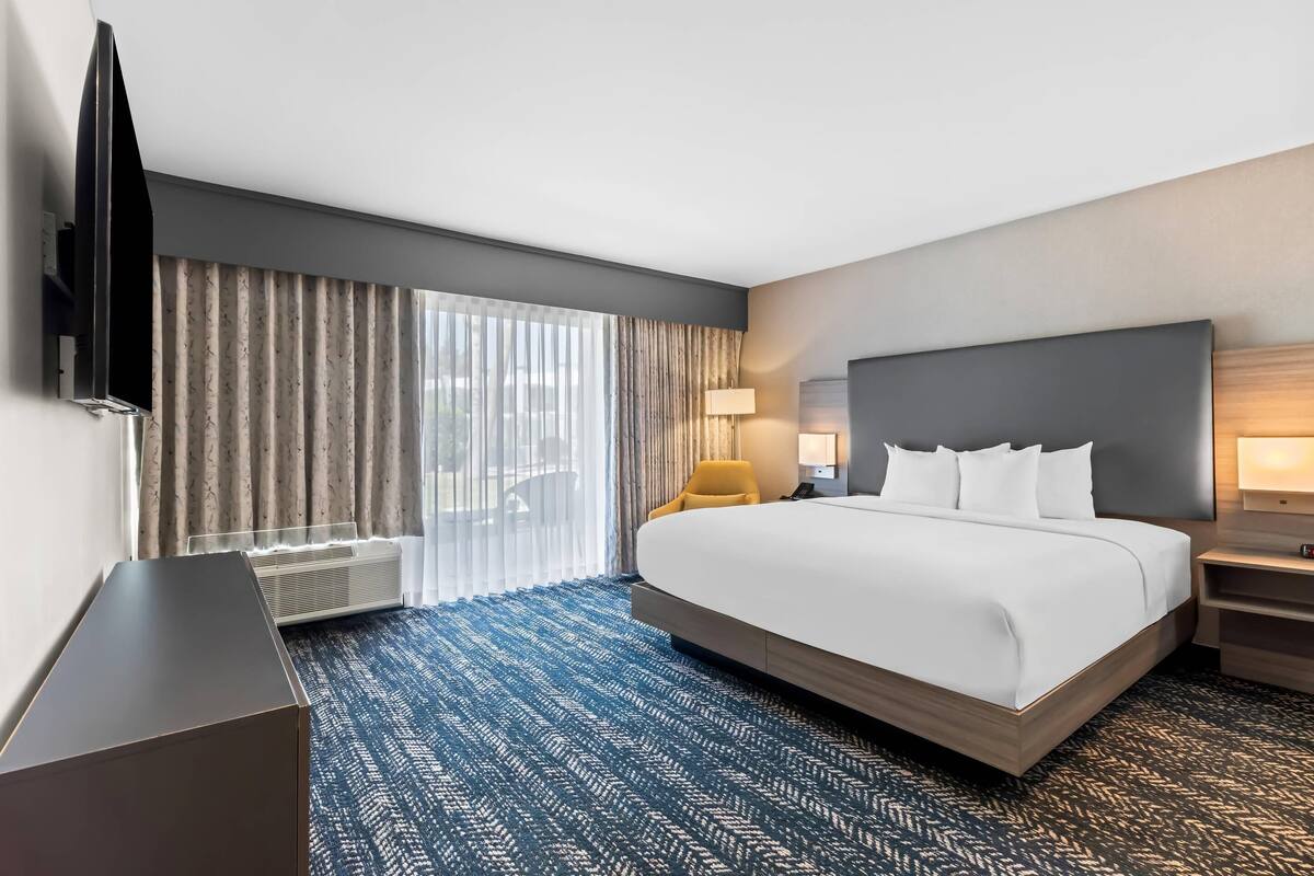 Two Room King Suite, Pool View | Pillowtop beds, desk, laptop workspace, blackout drapes