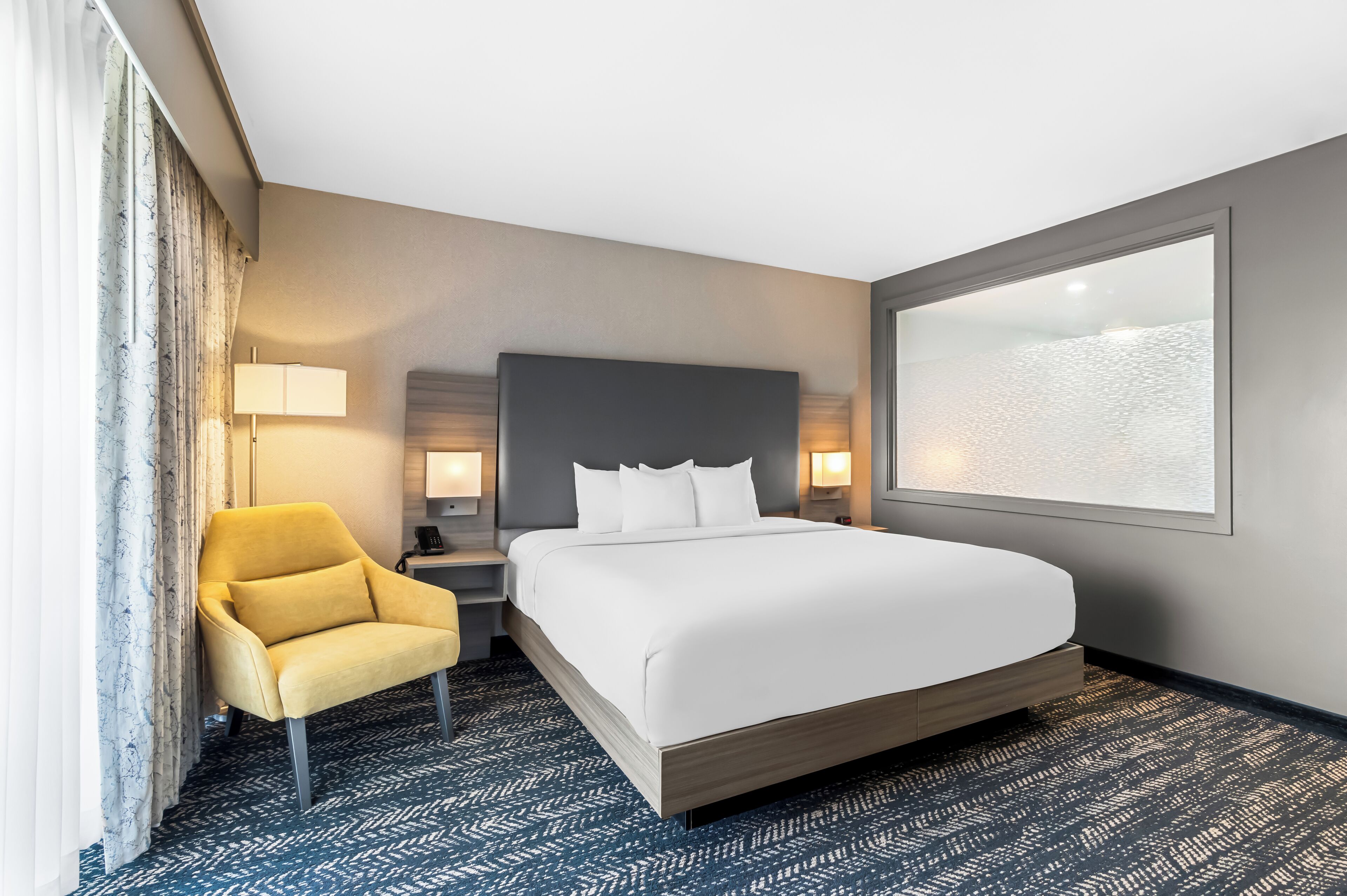 premium bedding, pillow-top beds, desk, laptop workspace