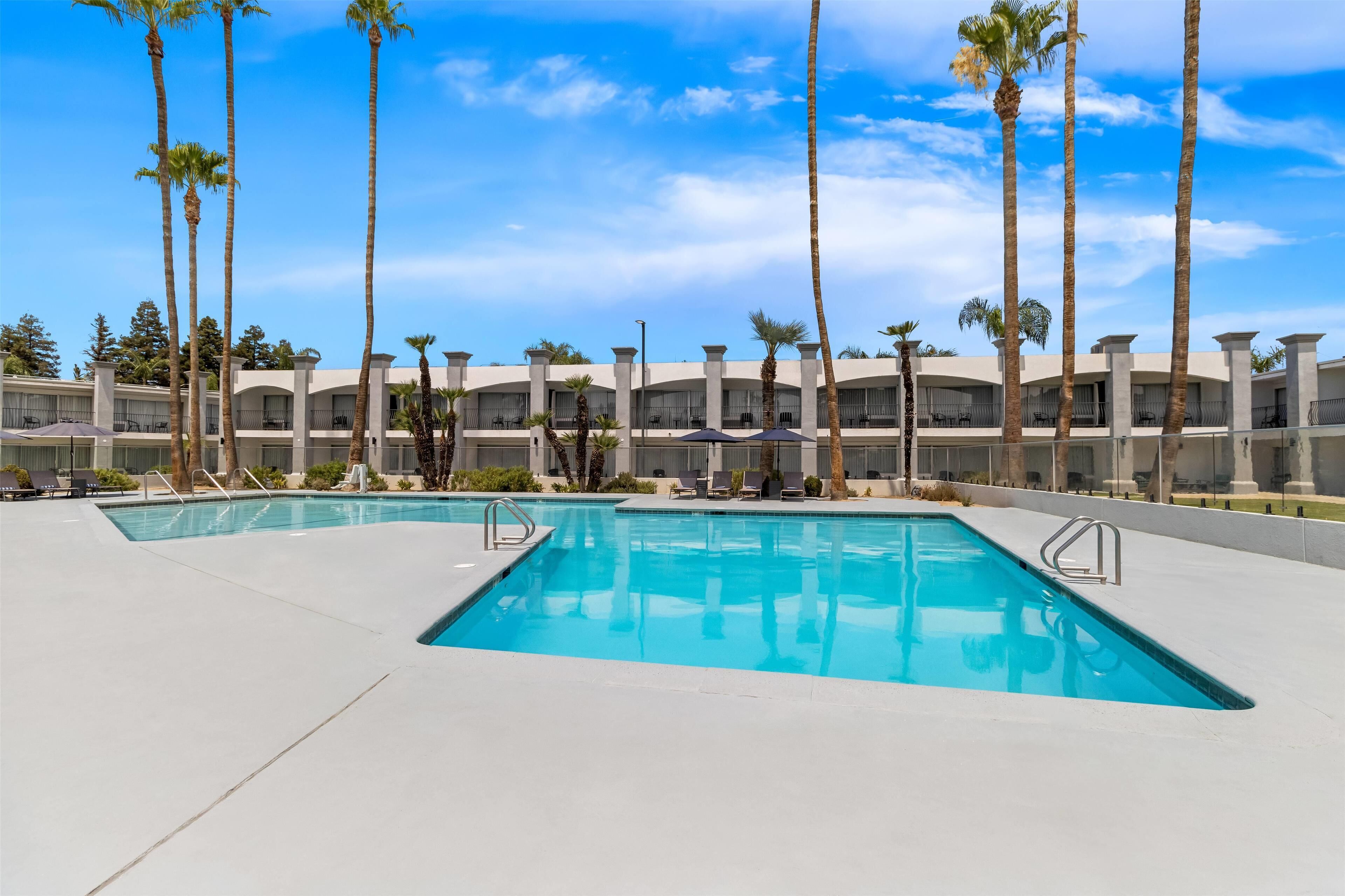 Outdoor pool, open 10:00 AM to 10:00 PM, free cabanas, pool umbrellas