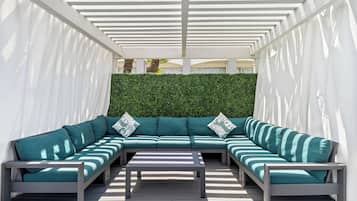 Outdoor pool, open 10:00 AM to 10:00 PM, free pool cabanas