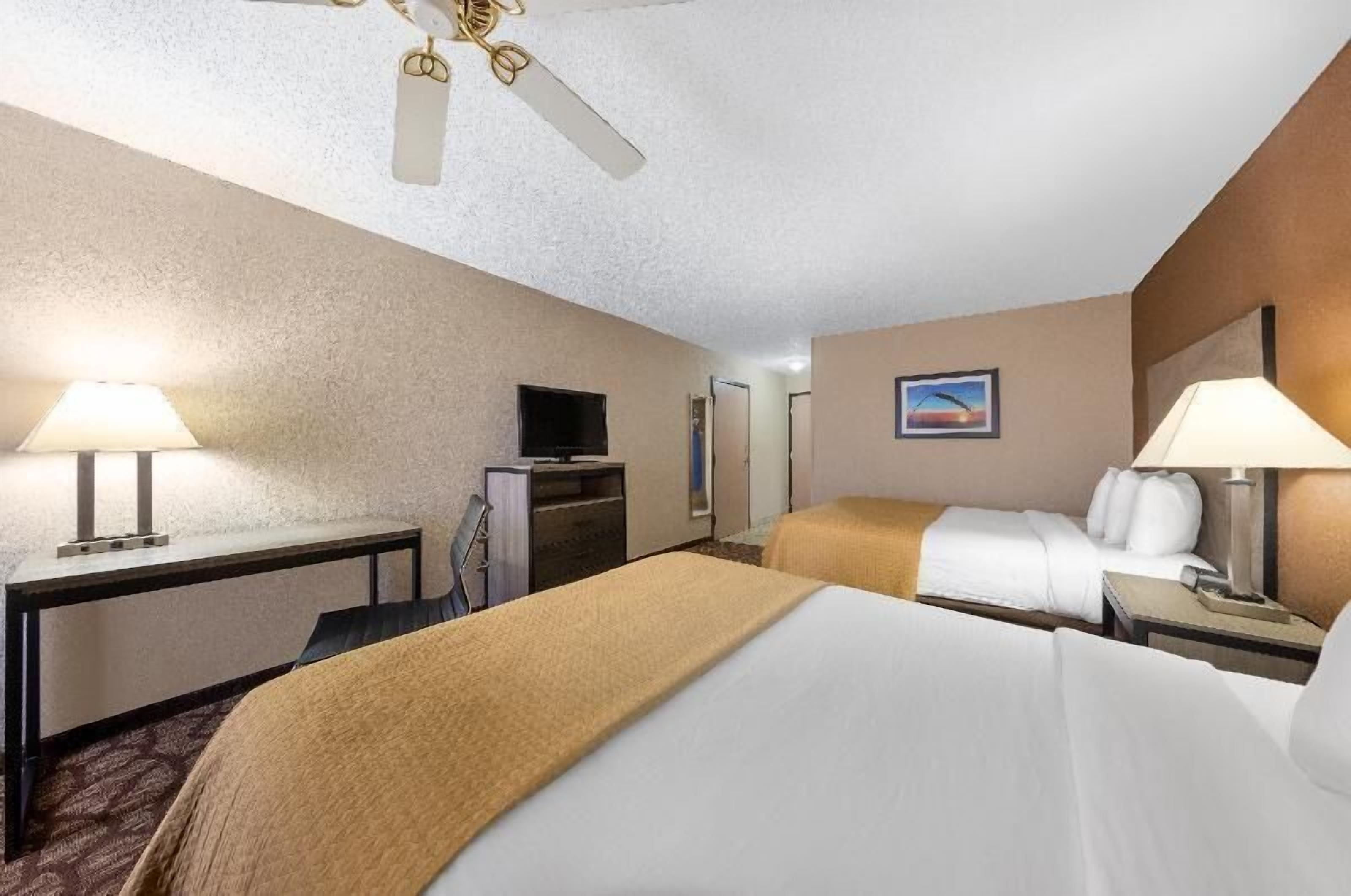 Pillowtop beds, desk, blackout drapes, iron/ironing board