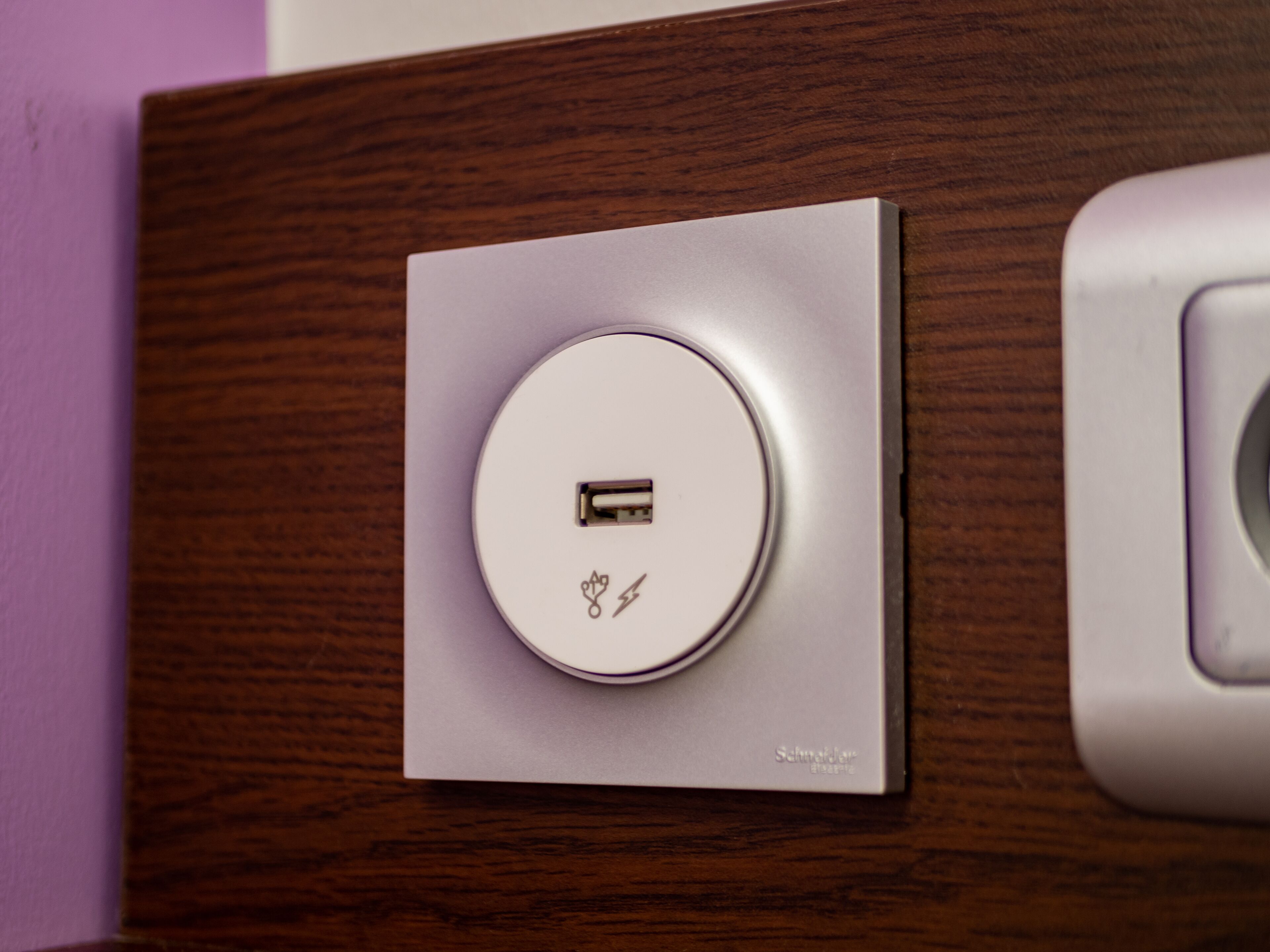A USB charging station on a wooden surface.
