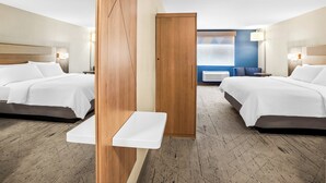 A hotel room with two beds, a small table, and a view of the city through the window. - Holiday Inn Express & Suites Tumwater – Olympia by IHG (Olympia)