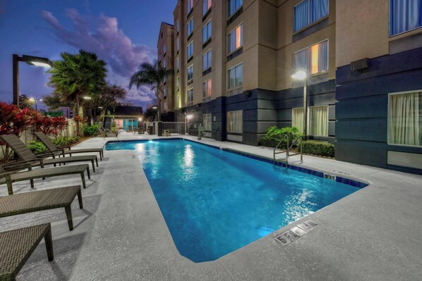 Outdoor pool, open 7:00 AM to 10:00 PM, pool umbrellas, pool loungers