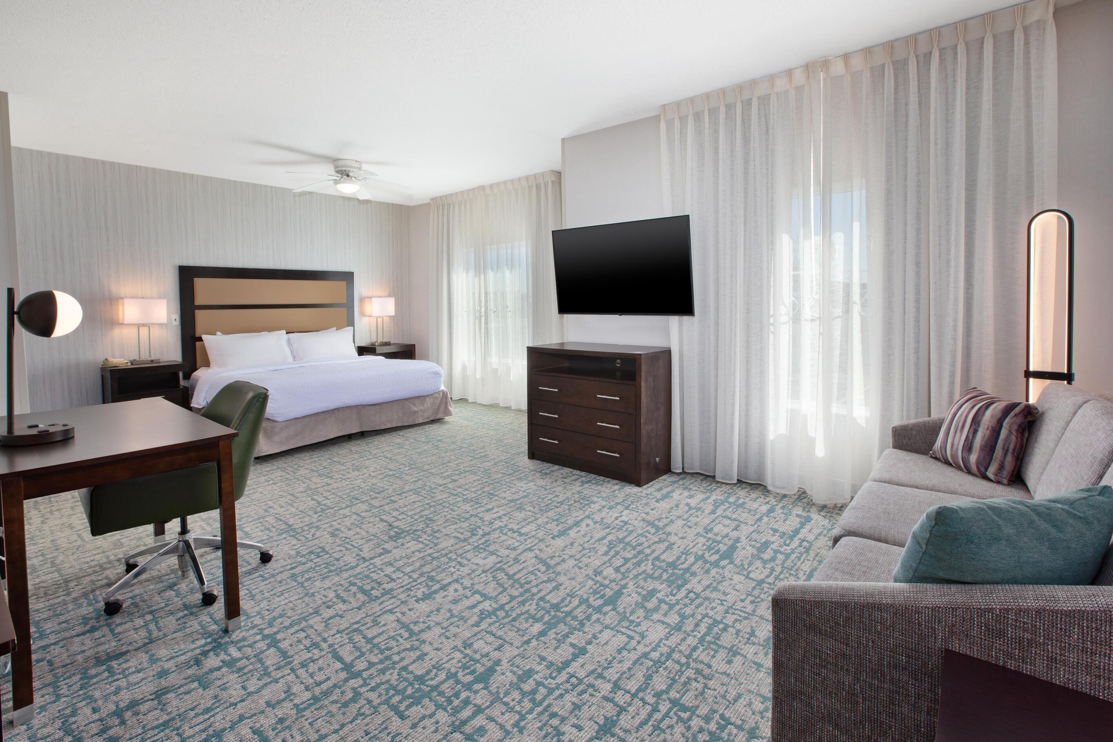 Desk, laptop workspace, blackout drapes, iron/ironing board