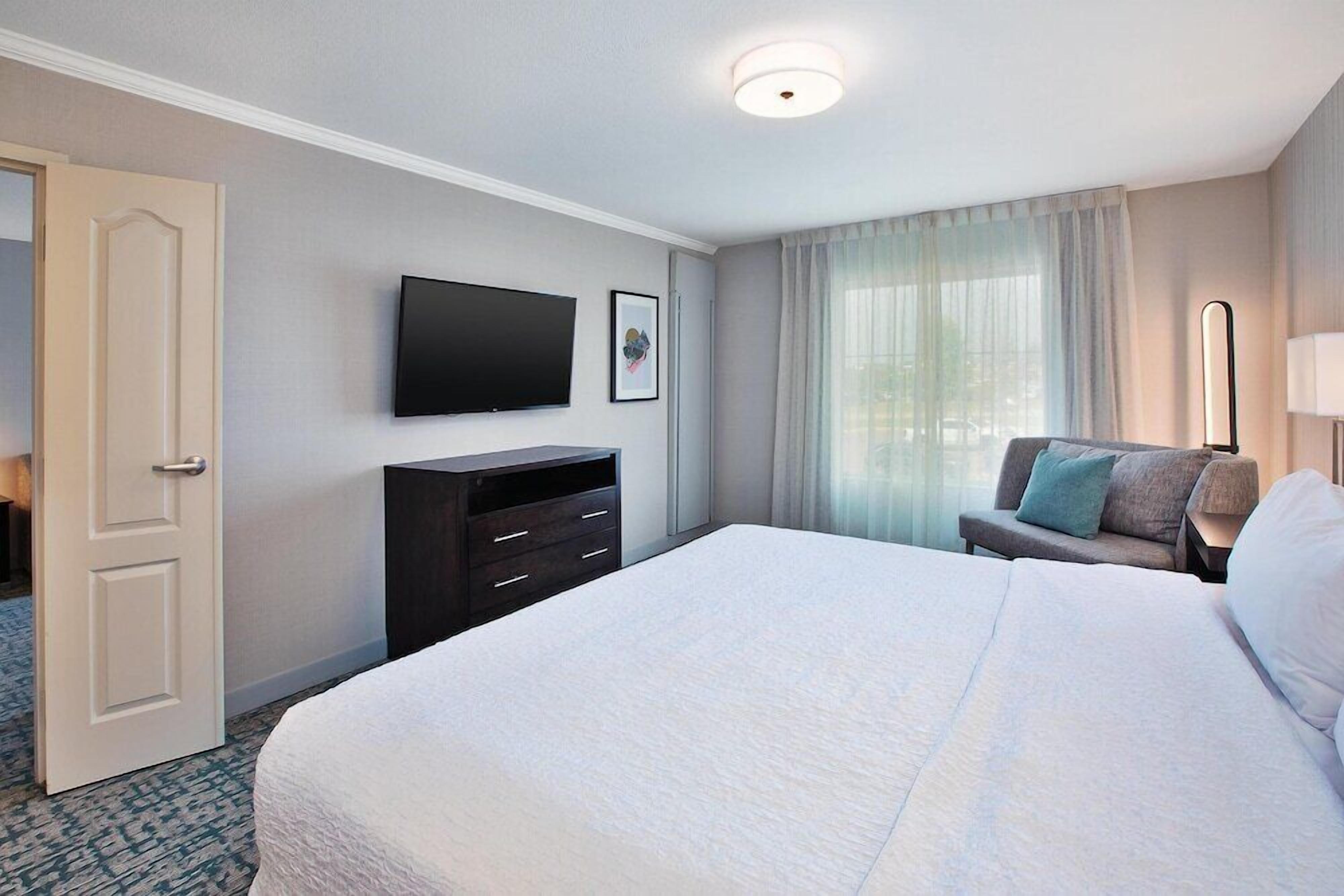 Desk, laptop workspace, blackout drapes, iron/ironing board