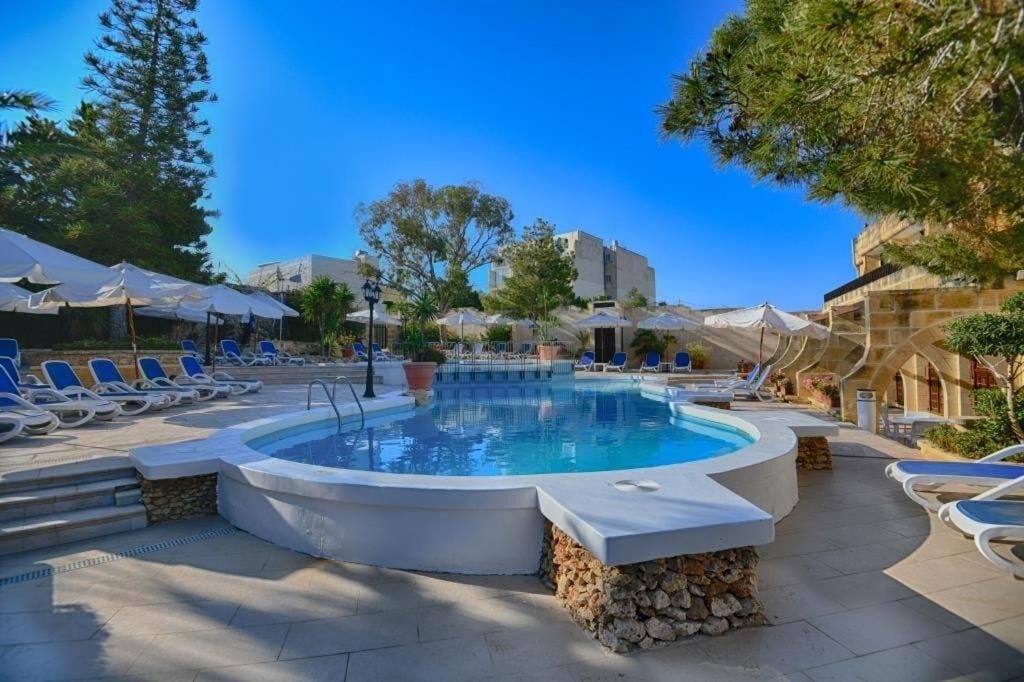 2 outdoor pools, pool umbrellas, pool loungers