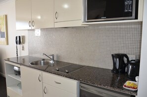 Fridge, microwave, stovetop, coffee/tea maker