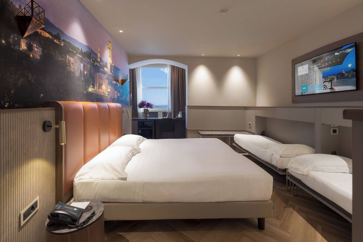 Frette Italian sheets, premium bedding, down duvets, minibar