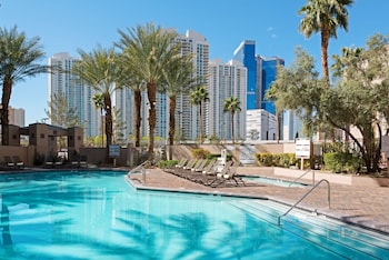 Outdoor pool, open 10:00 AM to 4:00 PM, sun loungers at Hilton Grand Vacations Club Paradise Las Vegas