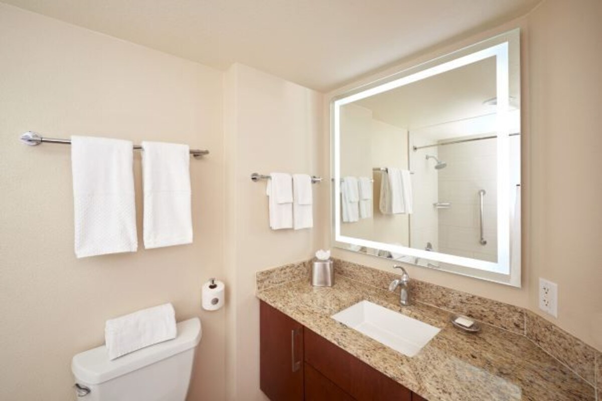 Designer toiletries, hair dryer, bathrobes, towels