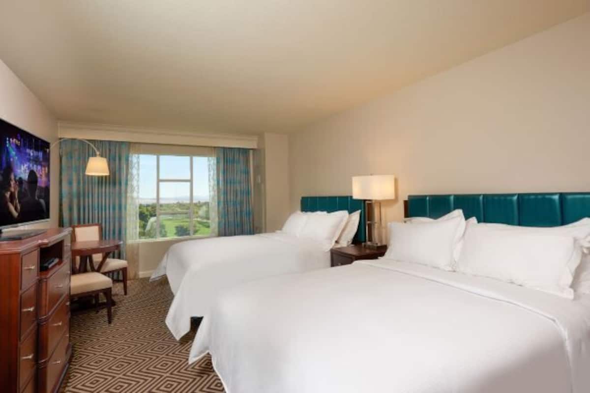 Premium bedding, down comforters, pillowtop beds, in-room safe