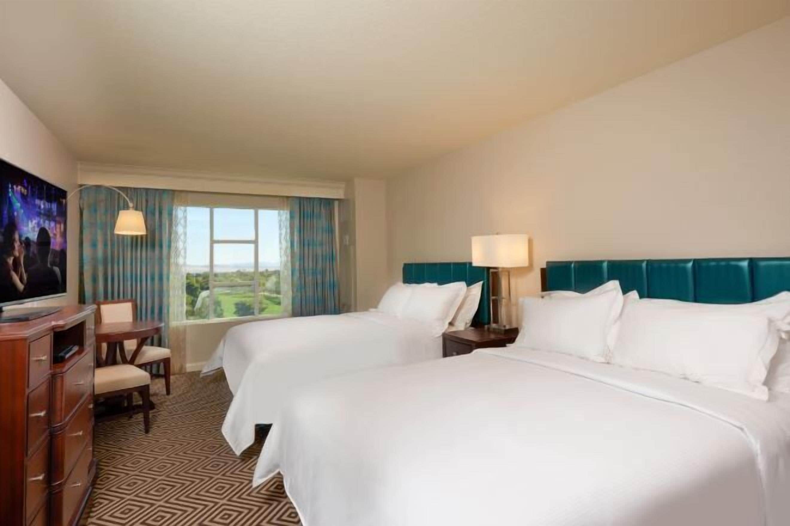 Premium bedding, down comforters, pillowtop beds, in-room safe